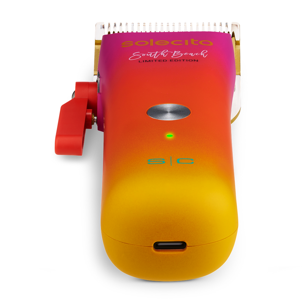 Solecito compact cordless clipper with gold blade, green indicator light on gradient body