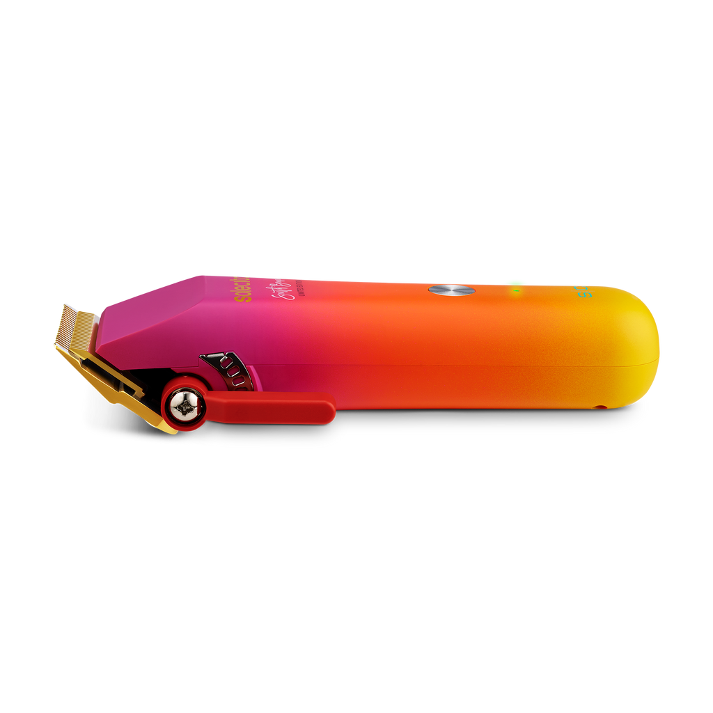 Solecito cordless clipper side view with gold blade, red control and magenta-orange body