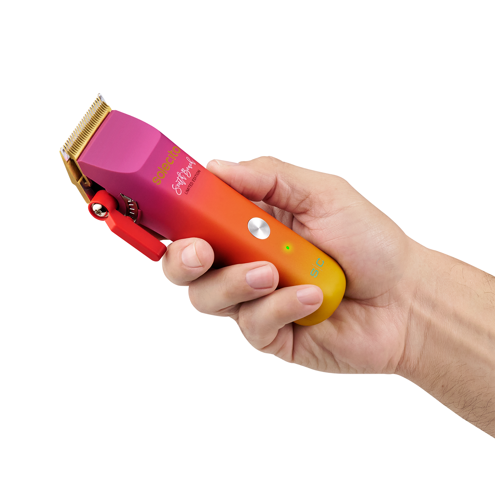 Solecito cordless clipper held in hand, gold trimmer blade, magenta-orange gradient body